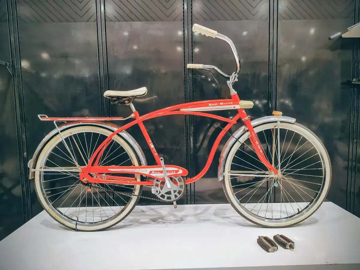 Restored vintage cruiser bicycle leaning against a wall
